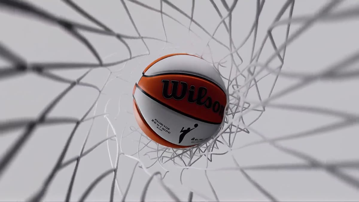 A basketball dropping through the net